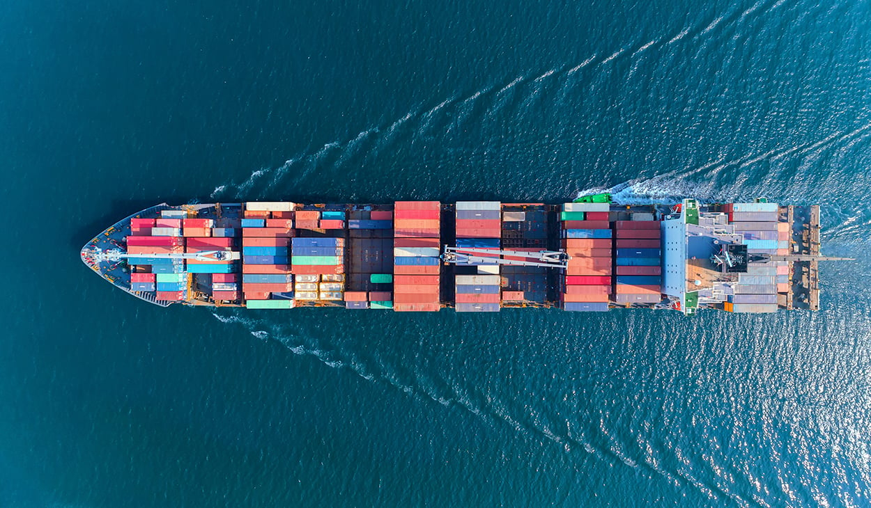 OFAC Sanctions List: Ship with colorful cargo from above